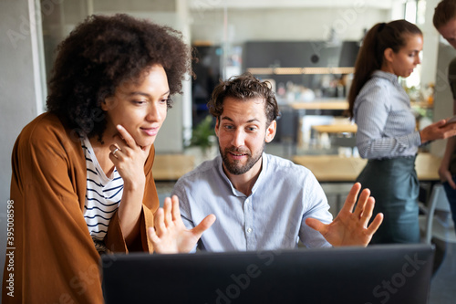 Software engineers working on project and programming in company