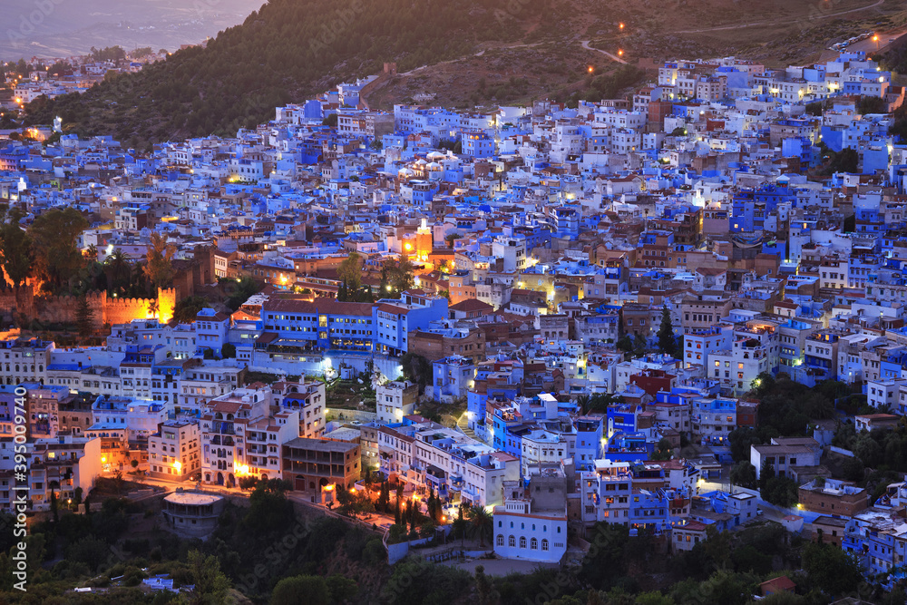 Aerial evening view of Chefchaouen in Morocco. The city is noted for its buildings in shades of blue and that makes Chefchaouen very attractive to visitors.