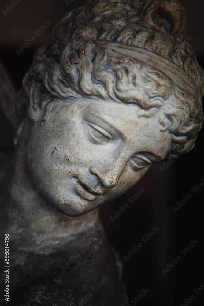 Close up Olympic goddess of love and beauty Aphrodite (Venus). Fragment of ancient statue.