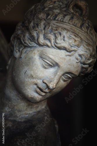 Close up Olympic goddess of love and beauty Aphrodite  Venus . Fragment of ancient statue.