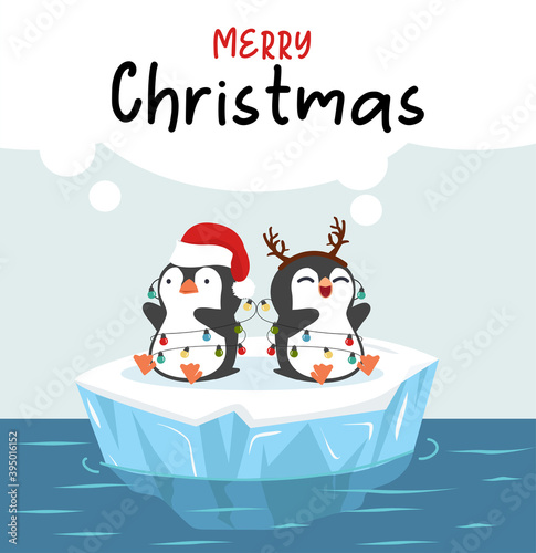 Cute little penguins wishing a Merry Christmas on ice floe