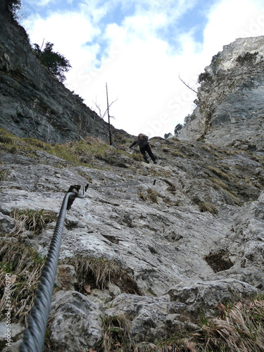 Climber at Drachenwand via ferrata, Salzburg, Austria photo