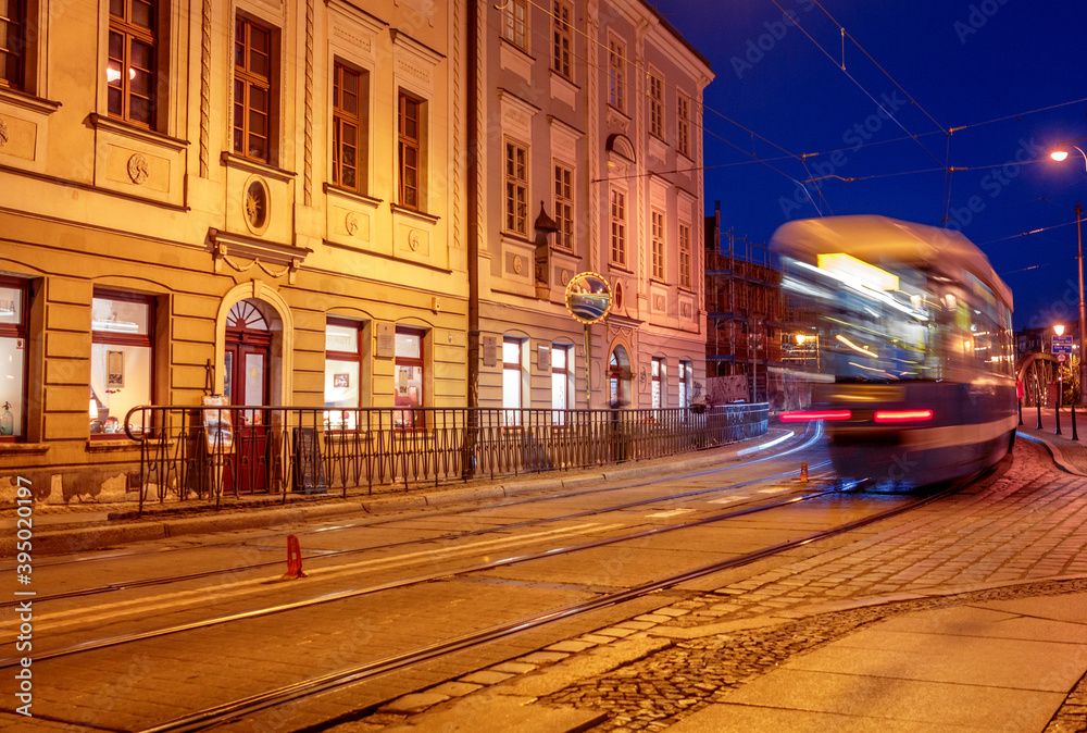 old Polish street with a passing tram