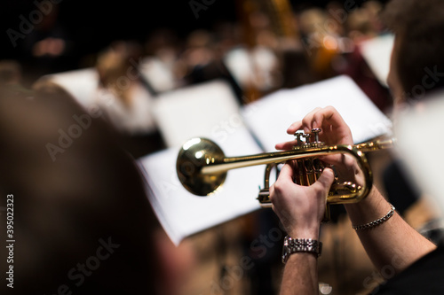 A person playing a trumpet during a rehearsal