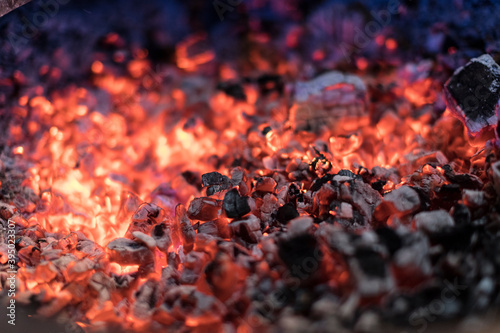 Burning charcoal with a shallow depth of field.
