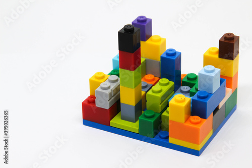 Colorful plastic building blocks isolated on white background.