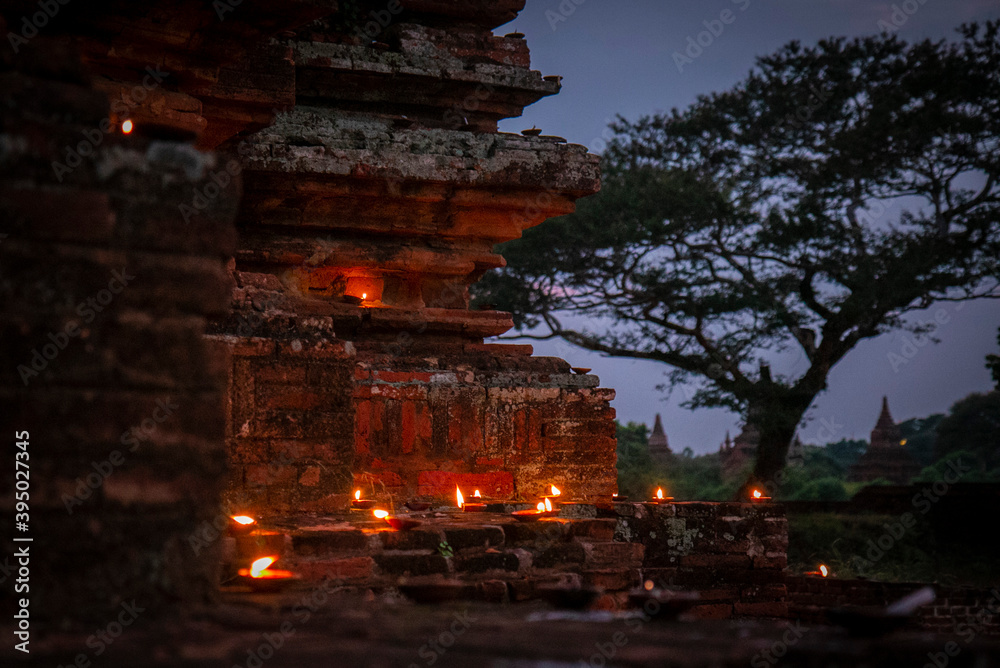Bagan temple outside with candles at night