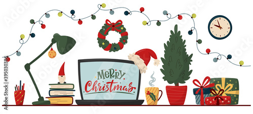 Christmas workspace interior. Office or freelancer table with computer, lamp, christmas tree, gifts, cup and books, Santa Claus hat. Colorful christmas concept for office, homework, freelance