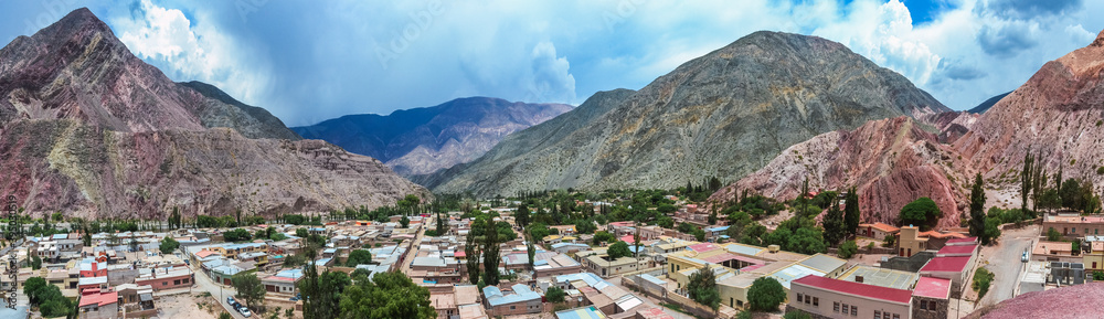 Panoramic stock photo of the colored hills and mountains in Purmamarca village , Jujuy, Argentina. Landscape