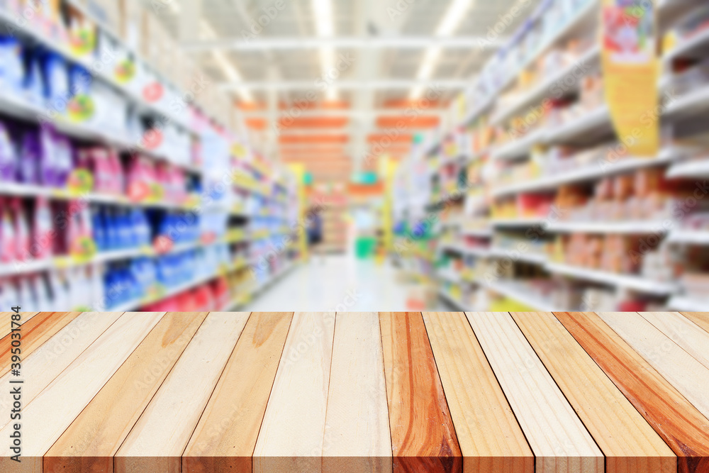 Empty wood table top on shelf in supermarket blurred background Empty wood table top on shelf in supermarket blurred background