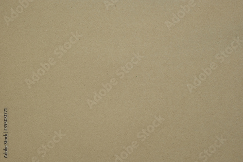 Texture of brown craft or kraft paper background, cardboard sheet, recycle paper, copy space for text.