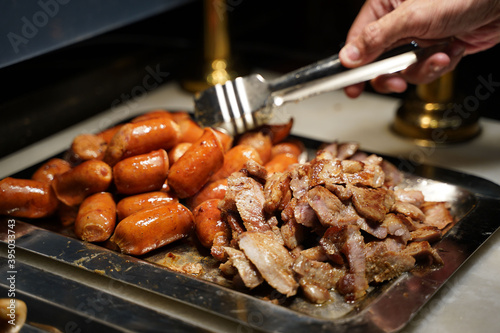 roast pork neck and sausage for eat © Sunanta