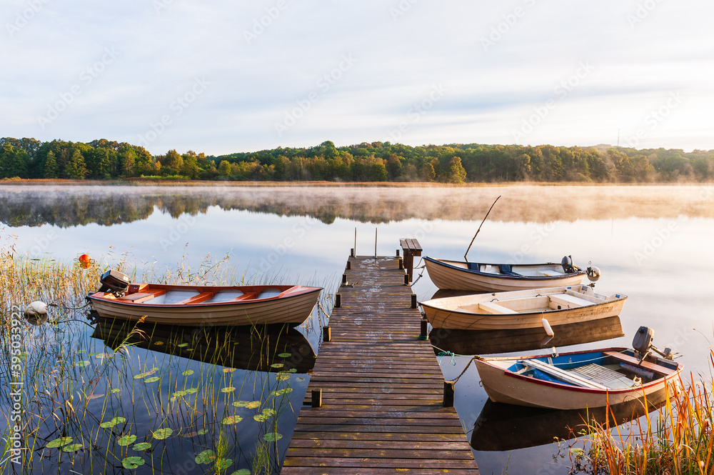 Fotografie Boats lying moored at a jetty