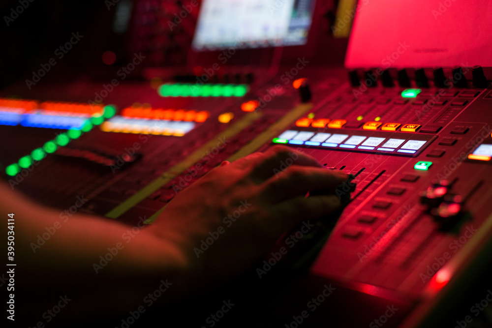 Fotografie A sound engineer working on a sound board