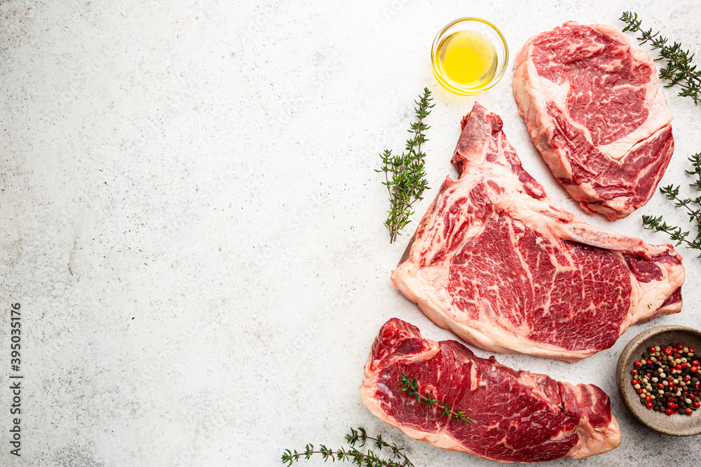 Φωτογραφία Variety of Fresh Raw Black Angus Prime Meat Steaks T-bone, New York, Ribeye and