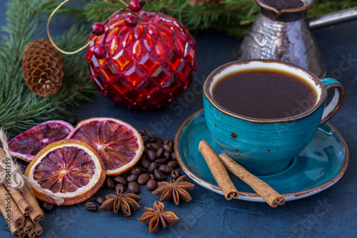 A cup of coffee on the background of New Year's decorations. Celebrating Christmas and New Years.