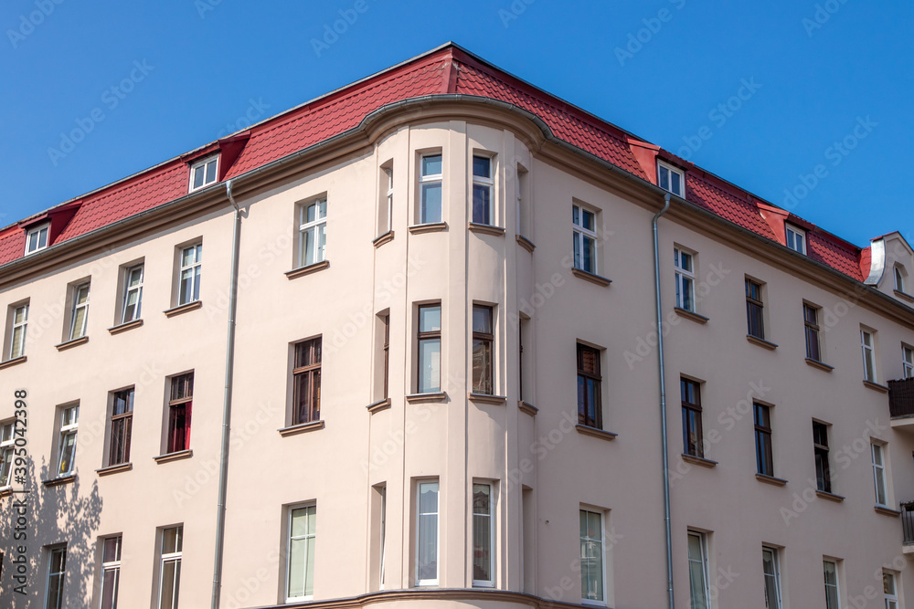 Old tenement houses on a background of blue sky