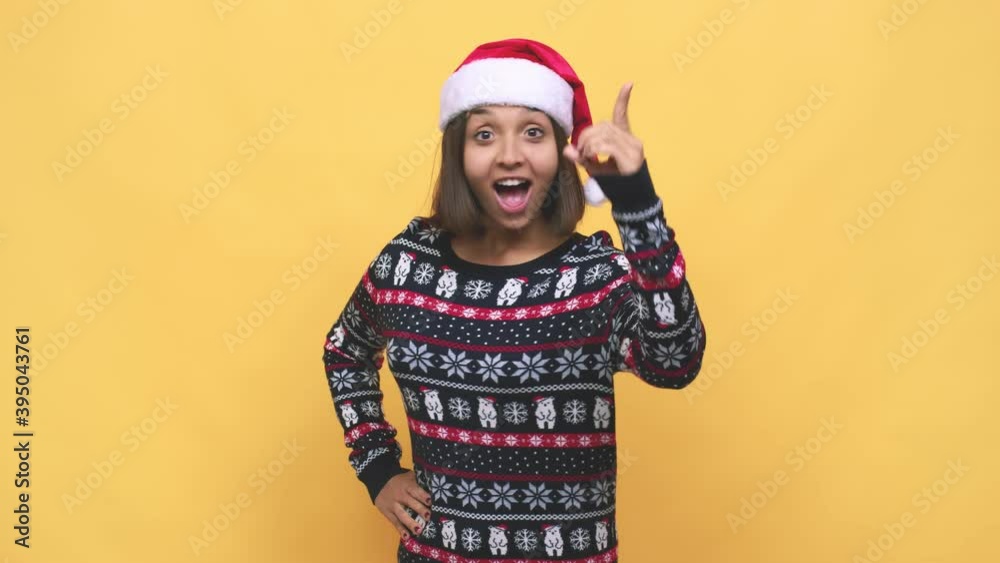 Young latin woman celebrating christmas day having an idea, inspiration concept Young latin woman celebrating christmas day having an idea, inspiration concept
