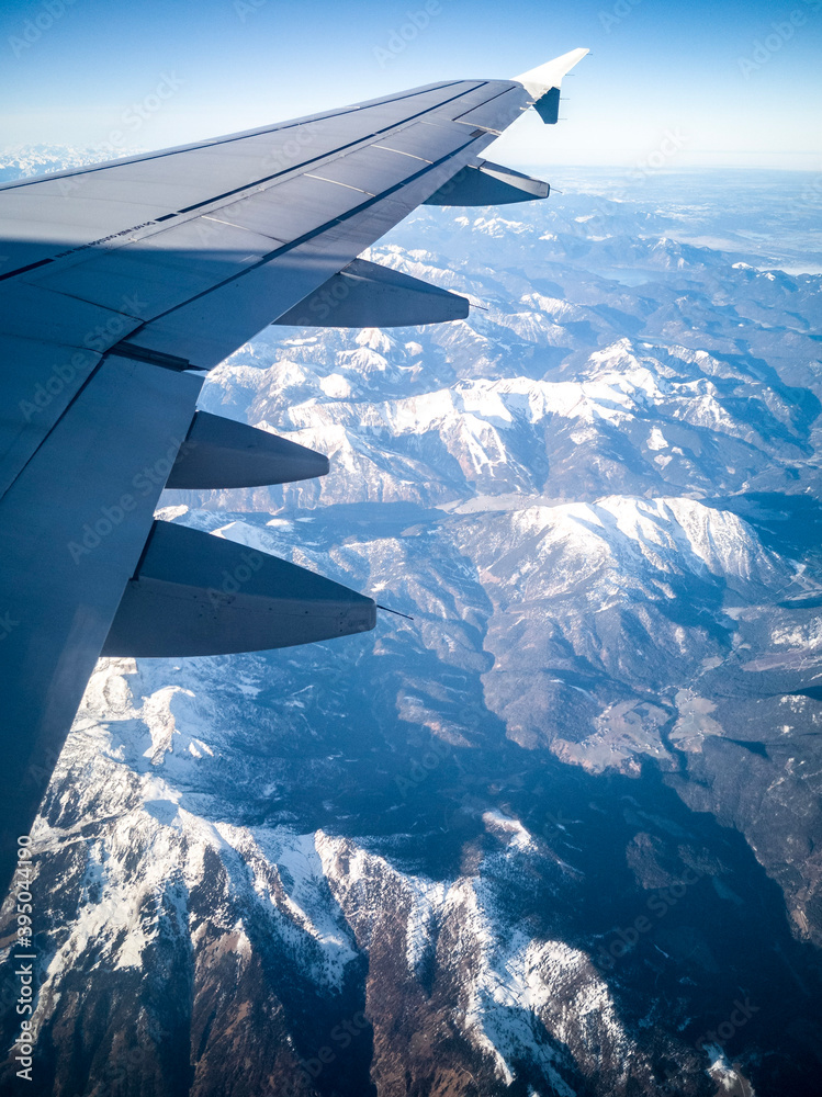 view from airplane window over mointains view from airplane window over mointains