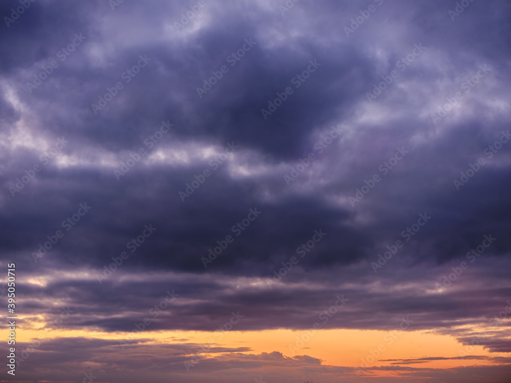 Dramatic sunset sky with clouds