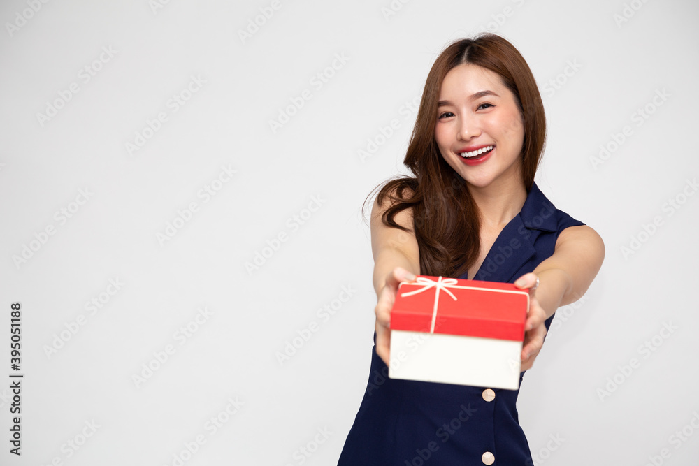 Happy beautiful Asian woman smile with red gift box isolated on white background. Teenage girls in love, Receiving gifts from lovers. New Year, Christmas and Valentines Day concept Happy beautiful Asian woman smile with red gift box isolated on white background. Teenage girls in love, Receiving gifts from lovers. New Year, Christmas and Valentines Day concept