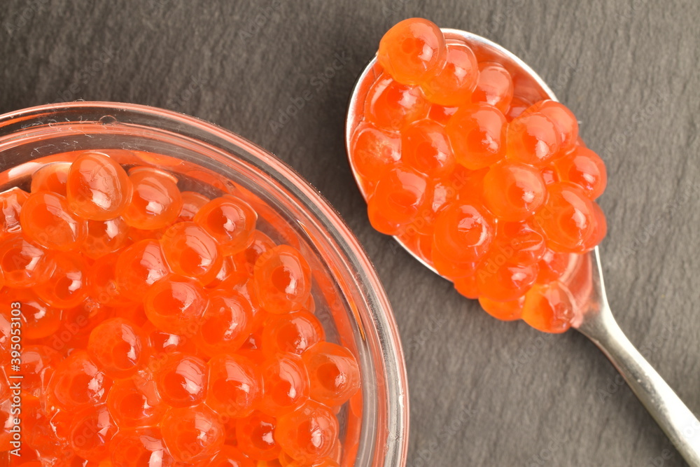 Red caviar, close-up, on a slate board. Red caviar, close-up, on a slate board.