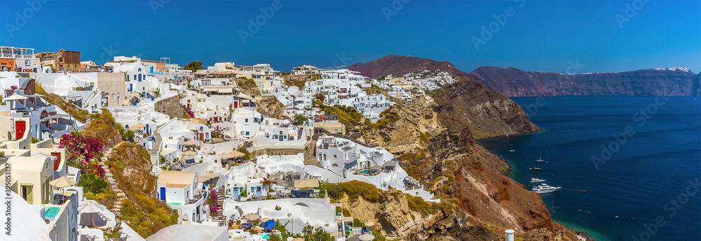 A panorama view of the village of Oia, Santorini and the caldera in summertime