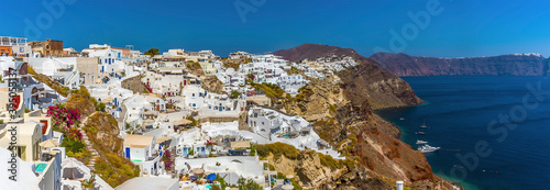 A panorama view of the village of Oia, Santorini and the caldera in summertime © Nicola