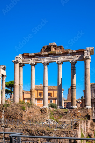 Templo de Vespasiano e Tito - Roman Temple Ruins in Roman Forum with Clear Blue Sky - Rome, Italy. photo