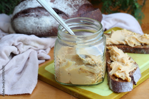 Brunost cheese with black bread and olives photo