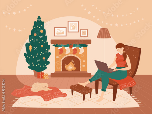 Happy alone girl sitting in chair near fireplace with laptop. Cute cat lying on red blanket. Warm vector illustration. Christmas interior with tree, socks, gift boxes. Holiday freelance concept.