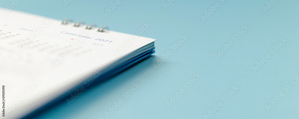 2021 calendar page on blue background business planning appointment meeting concept 2021 calendar page on blue background business planning appointment meeting concept