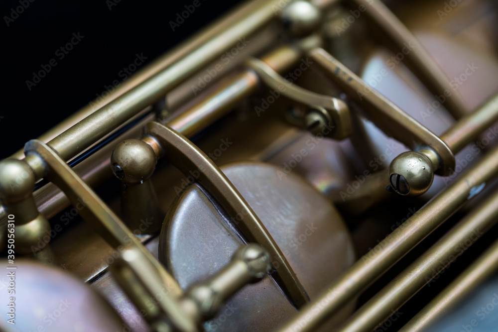 Fototapeta premium Vintage saxophone on a black background