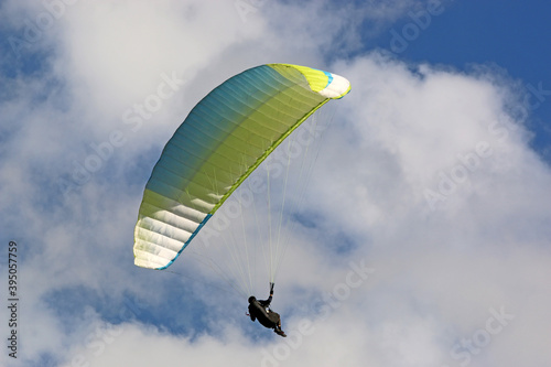 Wallpaper Mural Paraglider flying wing in a blue sky	 Torontodigital.ca