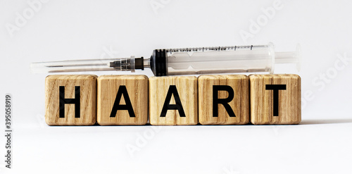 Text HAART made from wooden cubes. White background photo