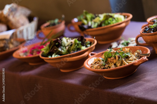Medieval dishes on a plate on a purple tablecloth