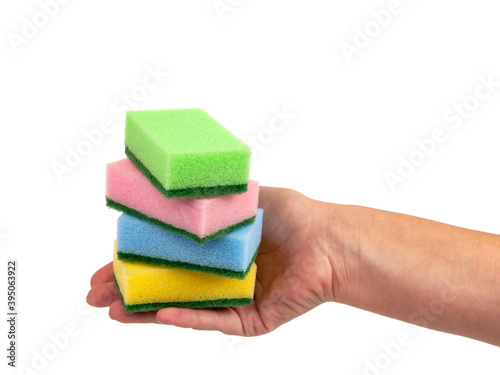 Sponge for washing dishes in hand isolated on the white