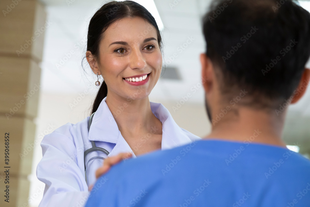 smiling female doctor helping support and reassuring patient after cancer surgical treatment recovery. medical and healthcare concept. smiling female doctor helping support and reassuring patient after cancer surgical treatment recovery. medical and healthcare concept.
