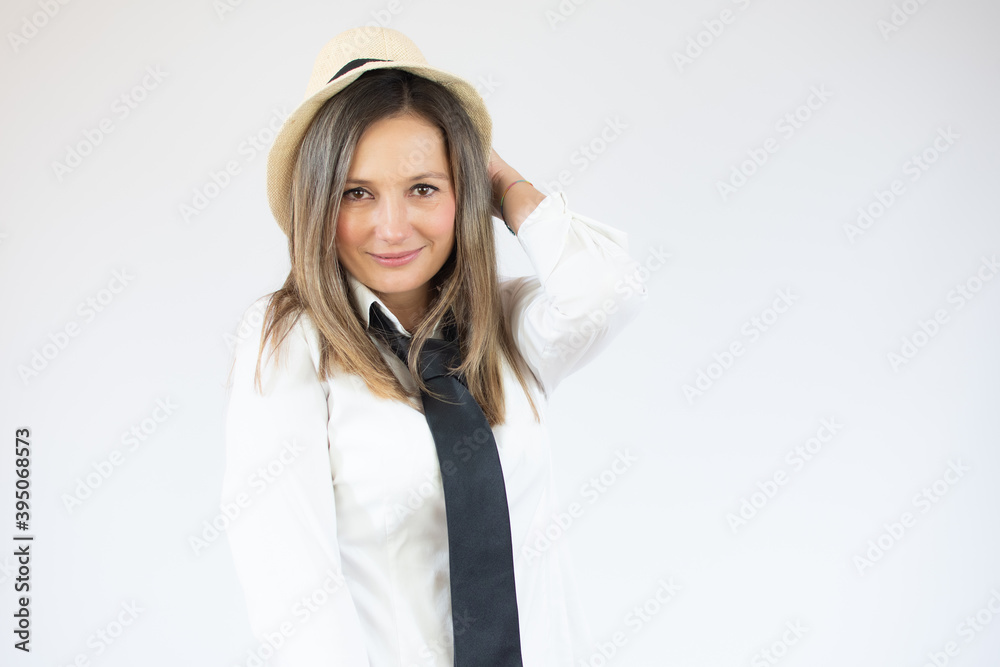 Portrait of a business woman wearing straw hat over white background. Portrait of a business woman wearing straw hat over white background.