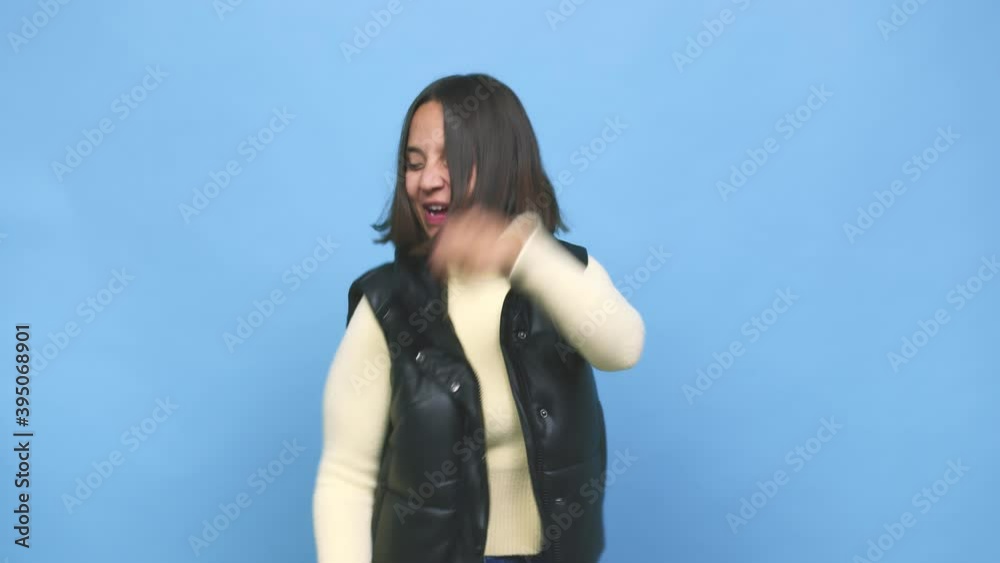 Young mixed race woman dancing and having fun Young mixed race woman dancing and having fun