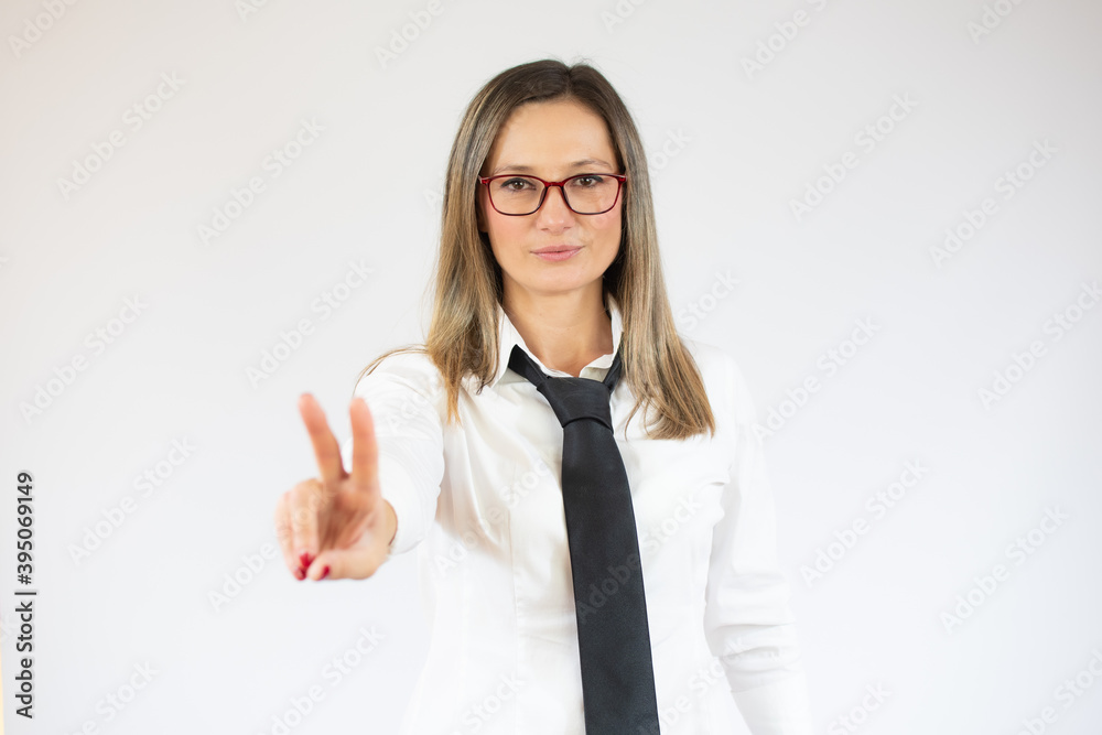 Business woman showing victory sign isolated on white background. Business woman showing victory sign isolated on white background.