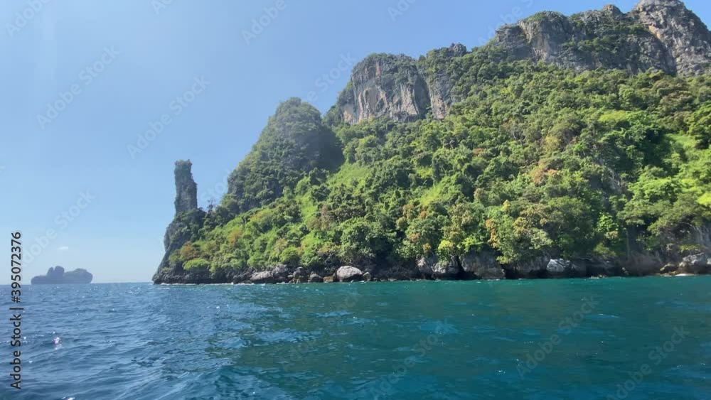 Thailand coast as seen from a moving boat, Phi Phi Islands on a beautiful sunny day