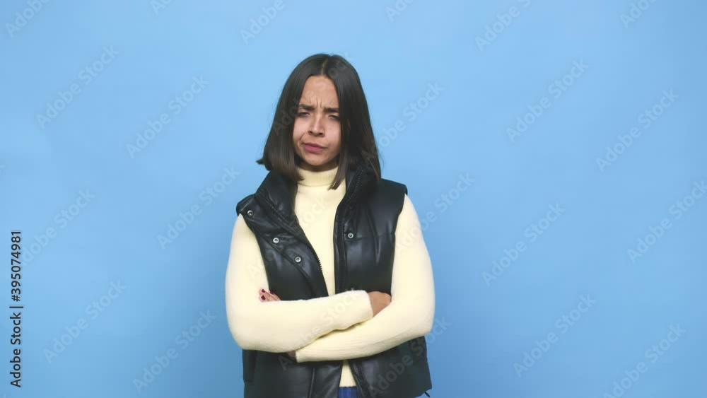 Young mixed race woman unhappy looking in camera with sarcastic expression Young mixed race woman unhappy looking in camera with sarcastic expression