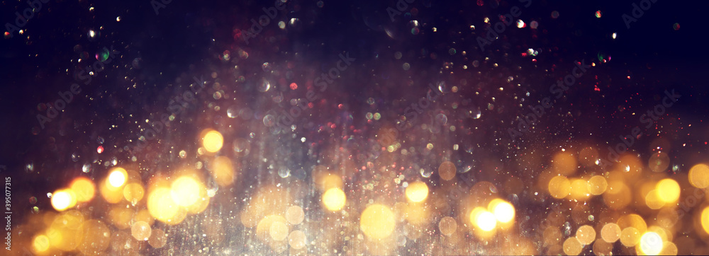 Obraz premium background of abstract glitter lights. silver, gold and black. de focused
