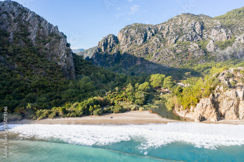 Fototapeta Naklejka Na Ścianę i Meble -  The sea and beach of Olympos (Olimpos) historic ancient city Hellenistic Roman Byzantine period. Kemer, Antalya, Turkey. Air view