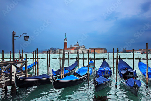 Gondolas in front of San Marco square, Venice, Italy. In the background, San Giorgio Maggiore. © Iraklis Milas
