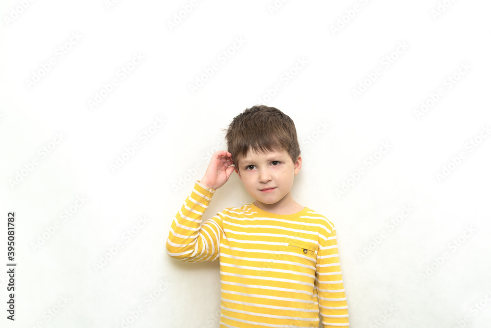 Cute toddler boy caucasian in striped shirt with funny expression. Cute toddler boy caucasian in striped shirt with funny expression.