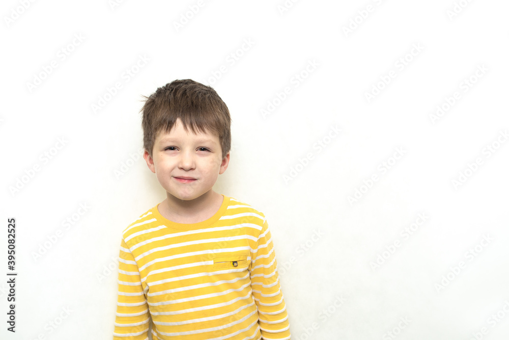 Cute toddler boy caucasian in striped shirt with funny expression. Cute toddler boy caucasian in striped shirt with funny expression.