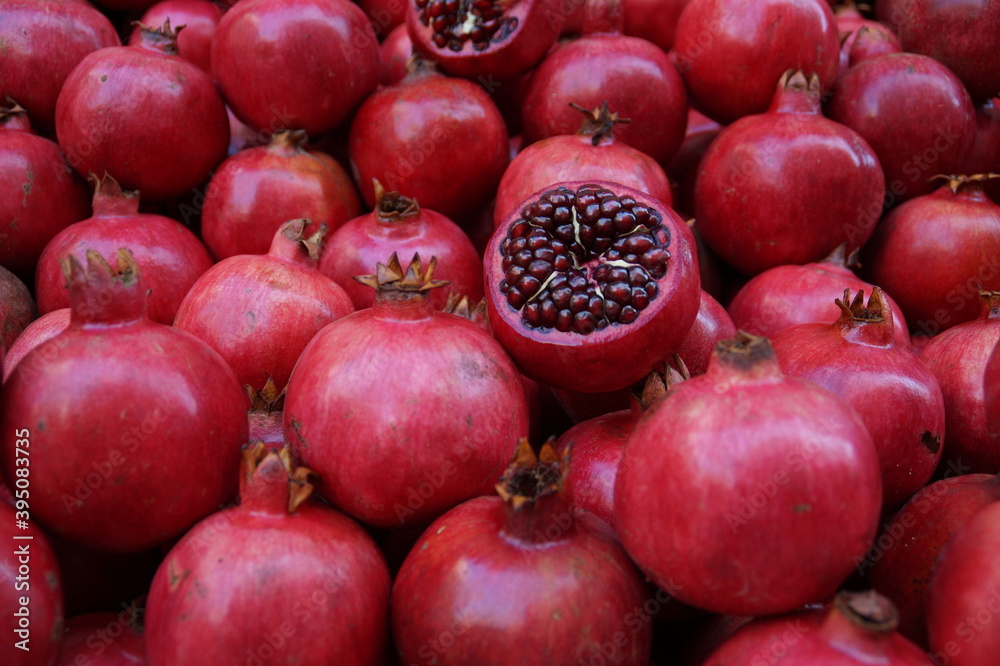 pomegranates that are sold in a Bazaar in southern Italy pomegranates that are sold in a Bazaar in southern Italy