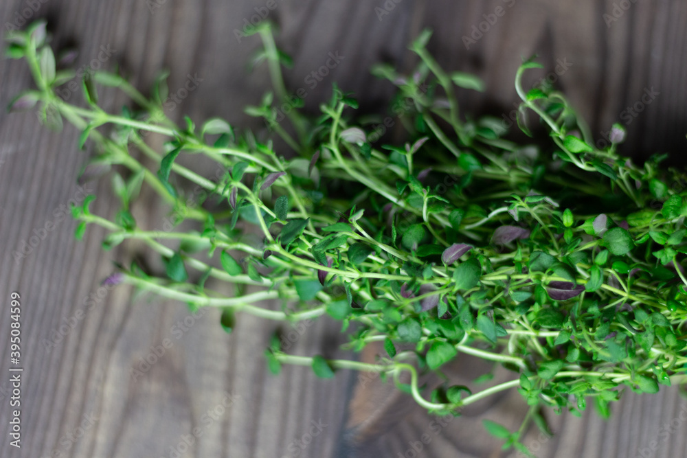 fresh herb thyme on a wooden brown table